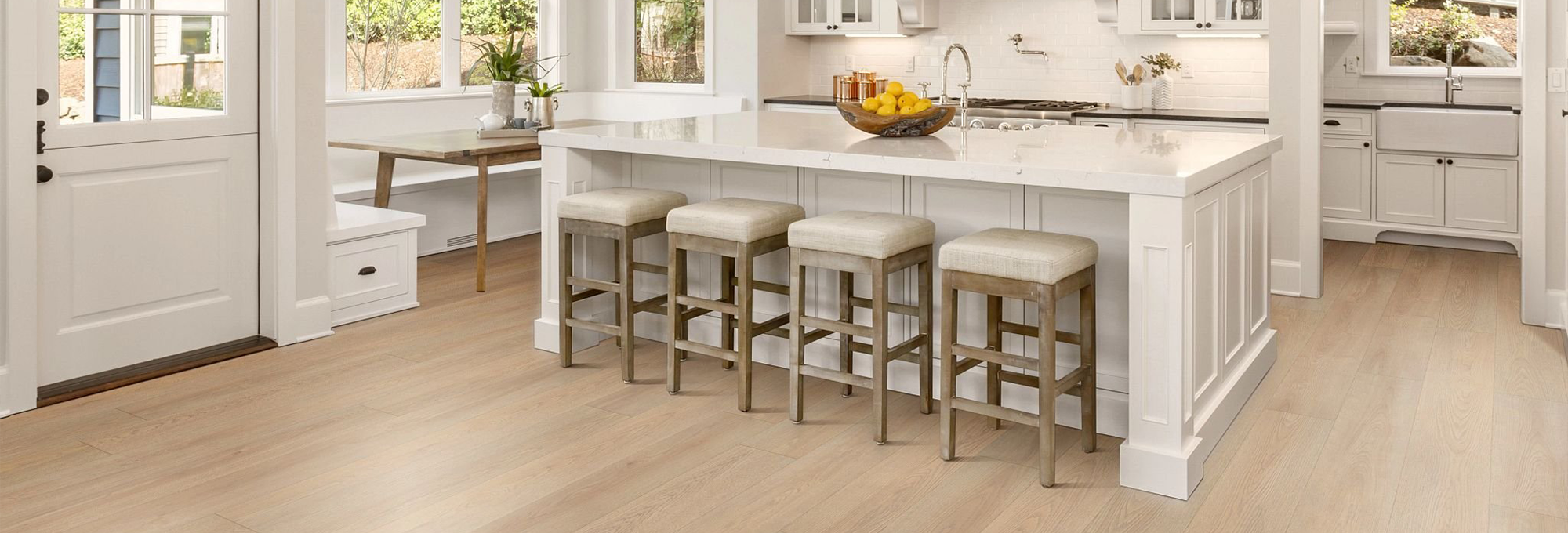 Kitchenette Area With Vinyl Plank Flooring And Stools provided by Direct Sales Floors in Danville, CA