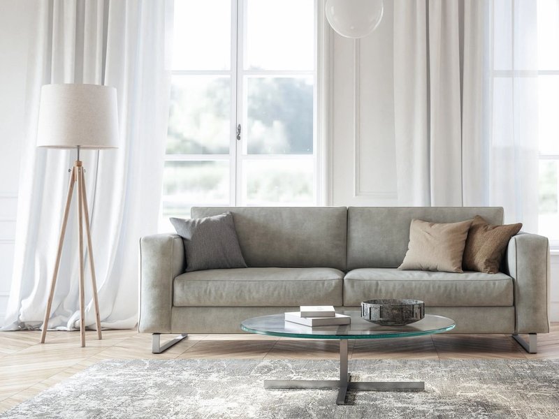 Living room with large windows, gray sofa and gray area rug from Direct Sales Floors in Danville, CA